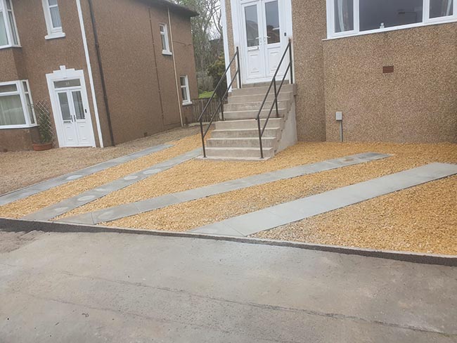 Decorative chips and grey slabs driveway