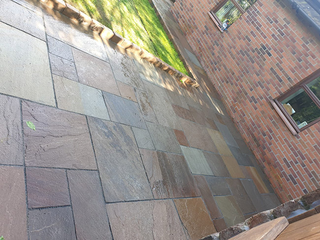 This patio design is autumn multi sandstone finish with bracken edgers