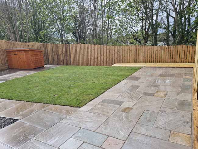 Grey multi-Indian sandstone paving patio