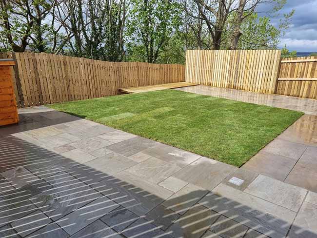 Grey multi-Indian sandstone paving patio